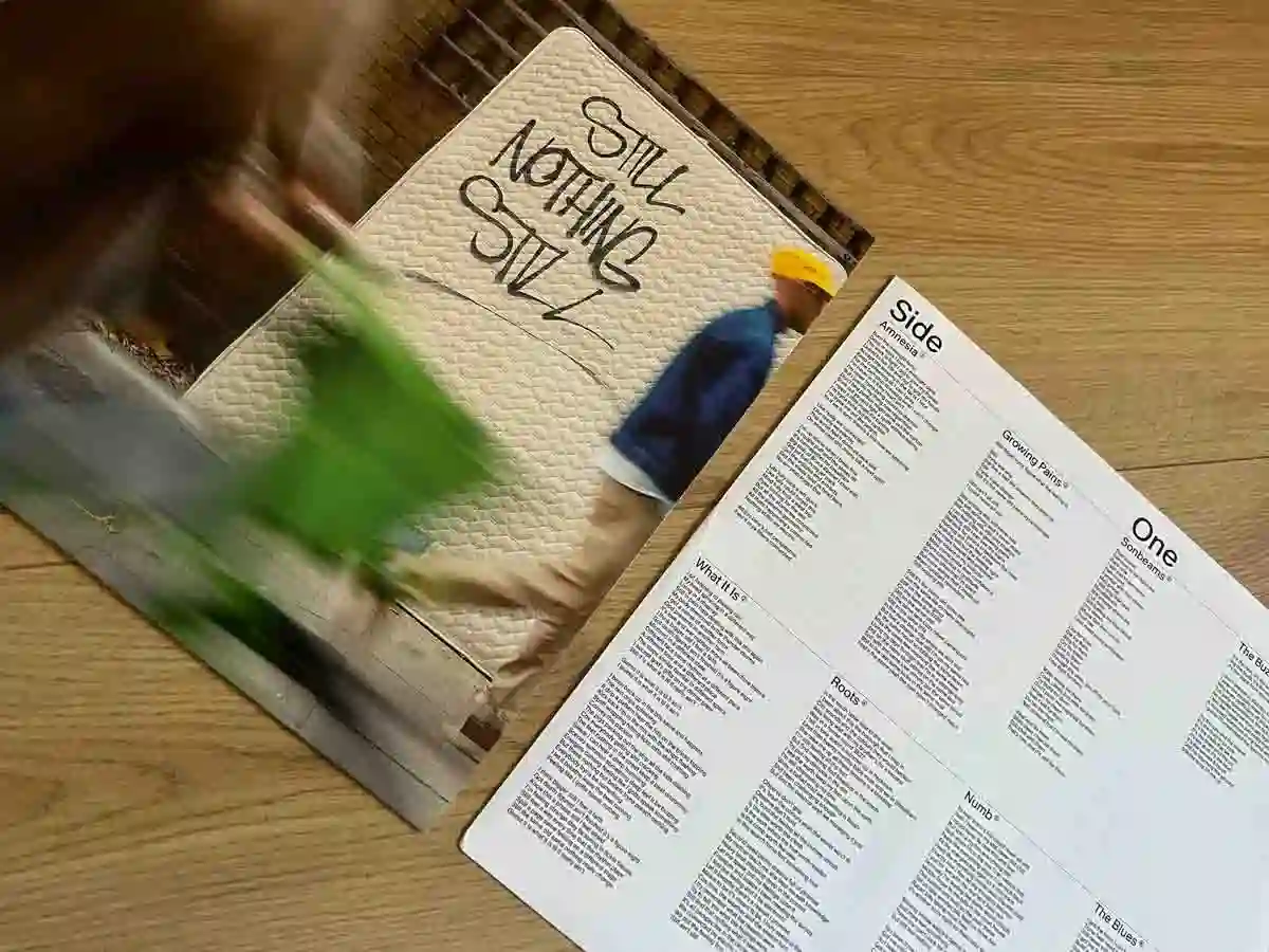 Summers Sons - Still Nothing Still Album Artwork placed on a tablew